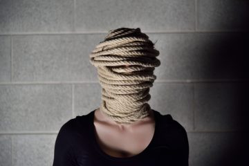 Person with rope around their head
